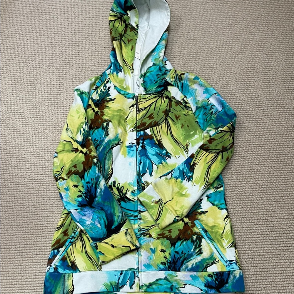 Women’s size 0 zip up hooded sweatshirt.  New with tags from Chico’s.